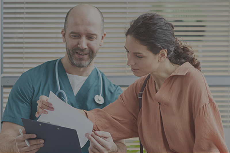 Satisfied Vet Techs Look Over Documents